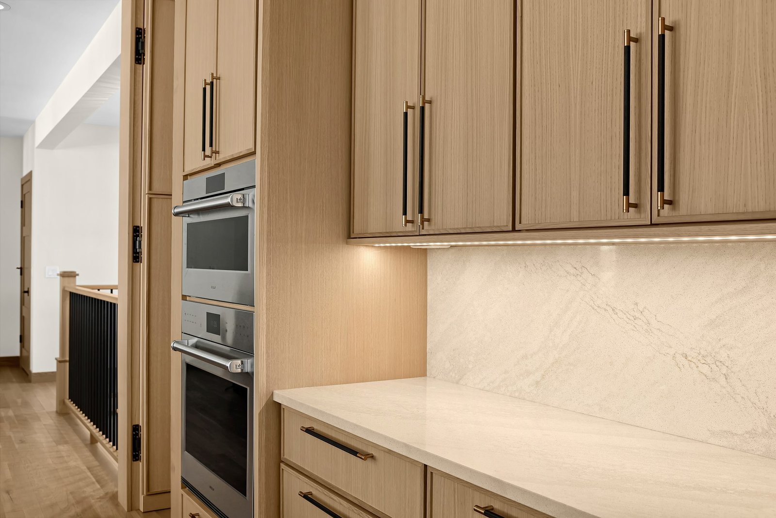 Natural oak full-height cabinetry detail