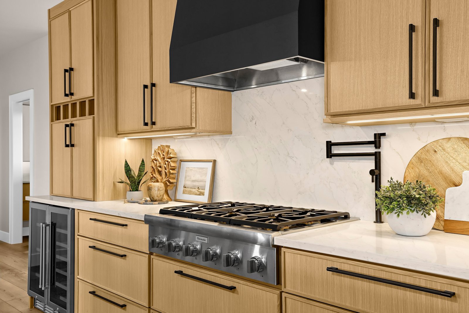 Natural oak kitchen with range and hood